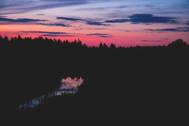 there is a sky that is purple, red and blue