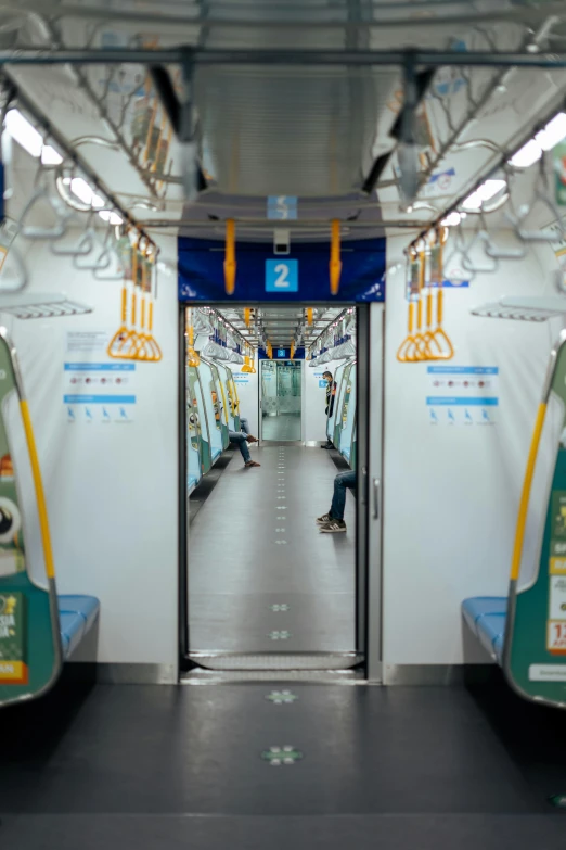 a view of the inside of a subway car, inspired by Steve McCurry, unsplash, seoul, square, an ultra realistic 8k octa photo, [ cinematic