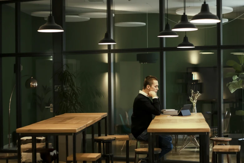 a person on his laptop at a table