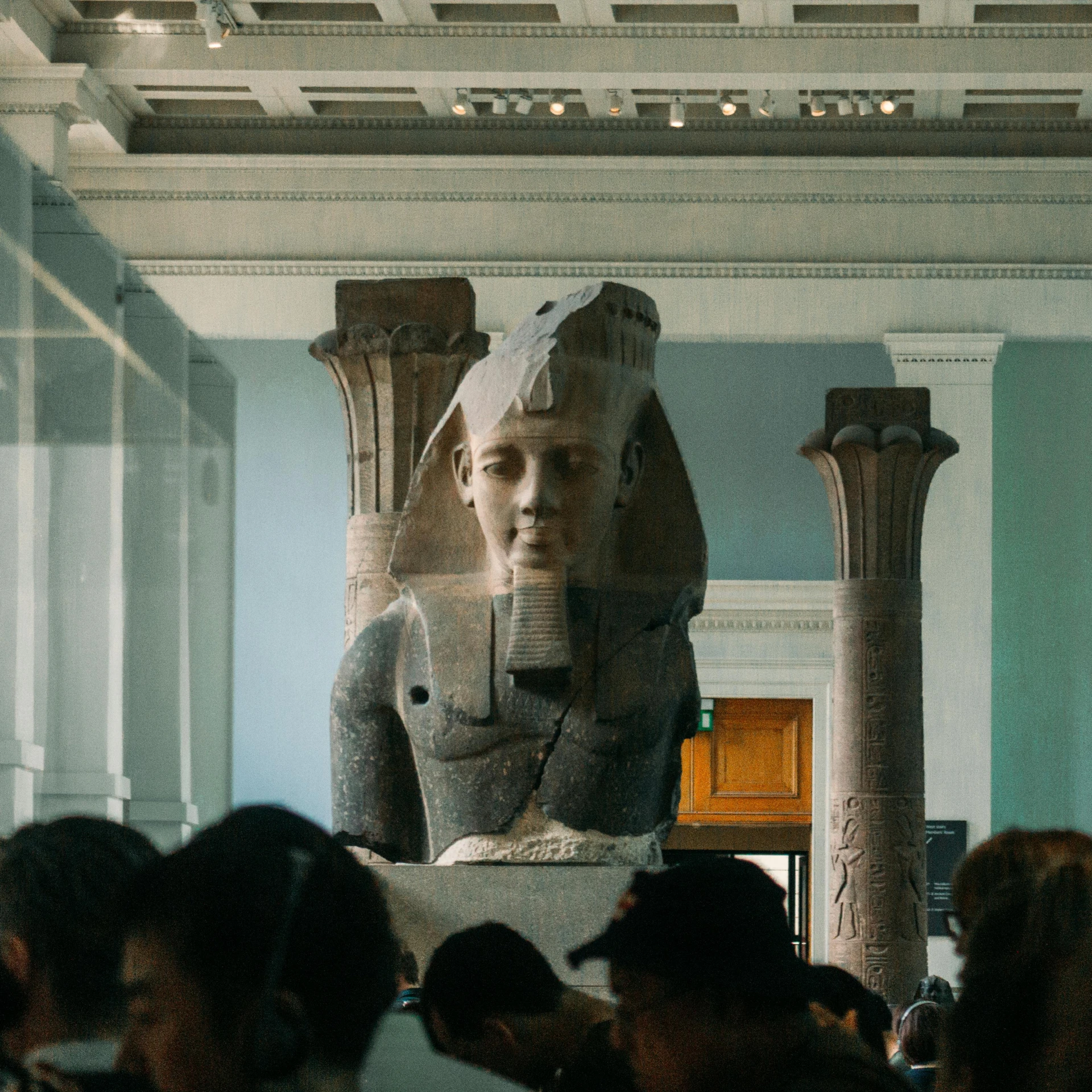 a group of people looking at a statue in a museum, pexels contest winner, hyperrealism, pharoah, in a large hall, summertime, max hay