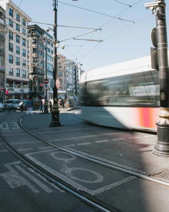 a city street filled with lots of traffic next to tall buildings, unsplash contest winner, art nouveau, tram, lgbt, thumbnail, istanbul