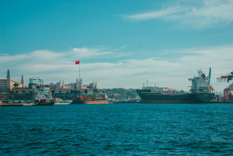 a large ship sitting in the middle of a body of water, by Elsa Bleda, pexels contest winner, hurufiyya, istanbul, trading depots, panorama, slide show