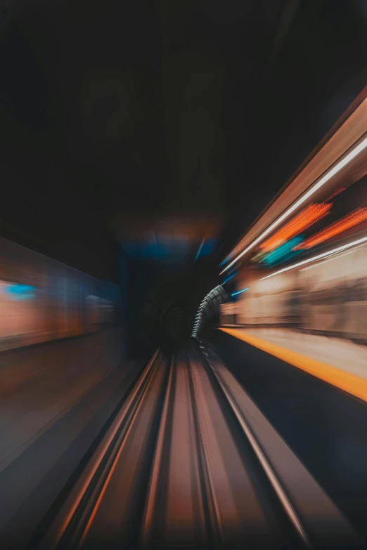 a blurry photo of a train going through a tunnel, unsplash contest winner, hypermodernism, gaming, high speed chase, captured on iphone, on black background