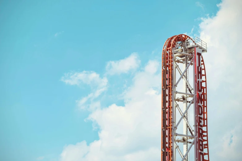 a roller coaster against a blue sky with clouds, by Bradley Walker Tomlin, hypermodernism, upside down stranger things, thunderbirds, moulin rouge, large scale photo