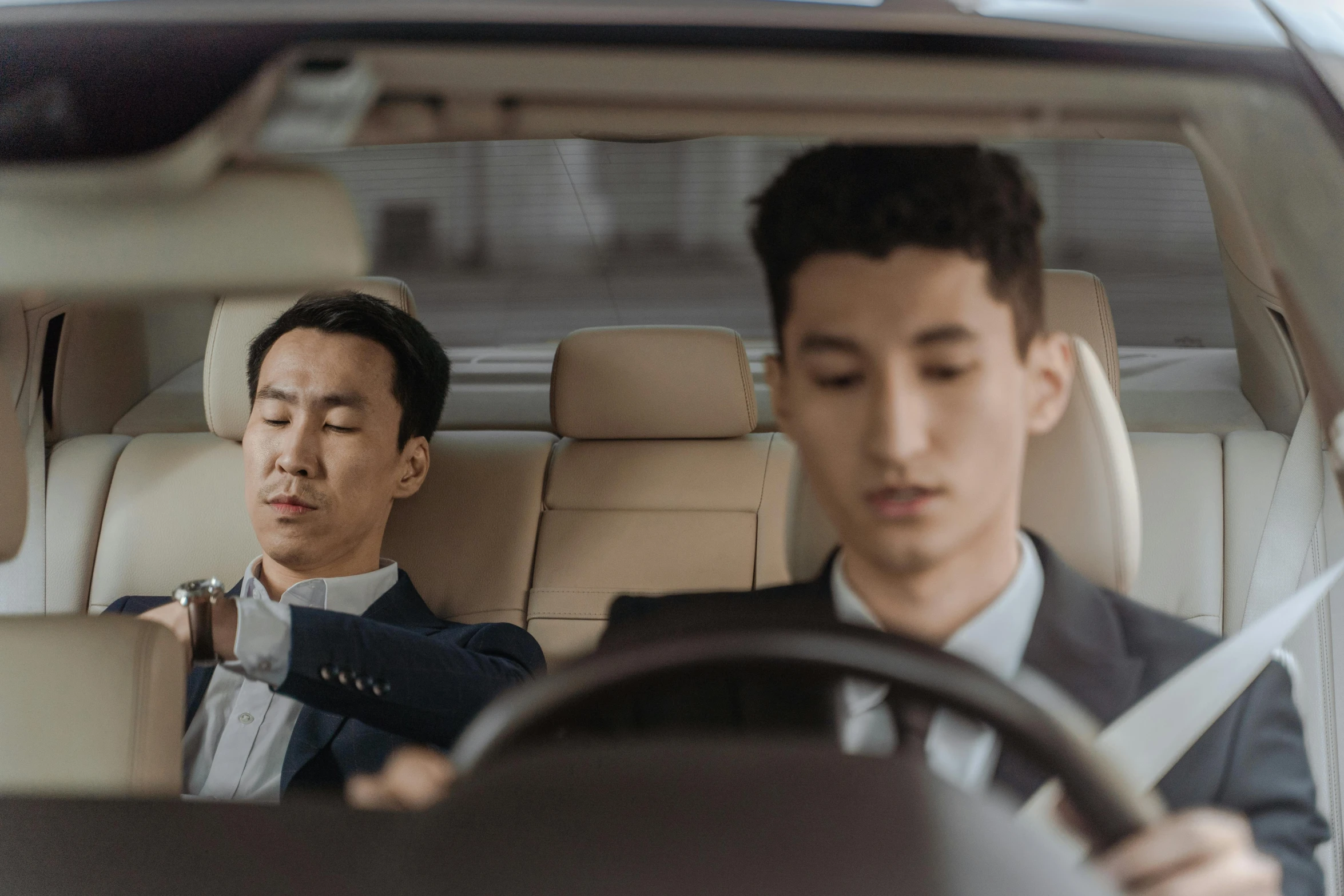 two men sitting in the driver's seat of a car, an album cover, by Jang Seung-eop, pexels contest winner, renaissance, sleepy expression, corporate boss, wonbin lee, passed out