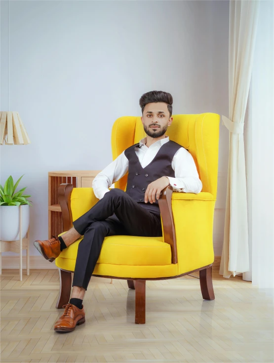 man in black dress vest sitting on a bright yellow chair