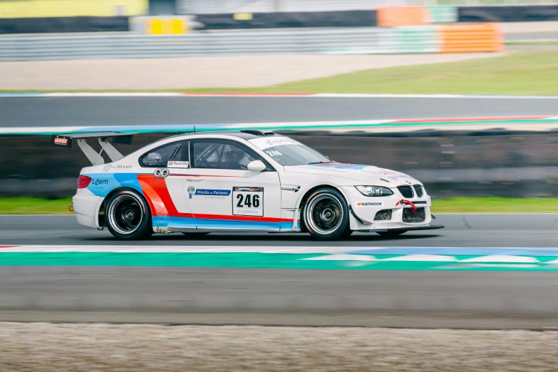 the car has been painted with a bright blue, red and white stripe