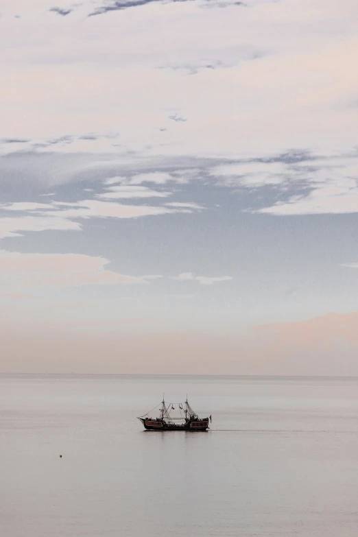 a boat floating on top of a large body of water, by Andries Stock, minimalism, at gentle dawn pink light, black sea, in muted colours, contemplation