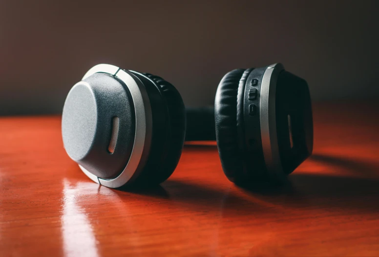 a pair of headphones sitting on top of a wooden table, pexels, avatar image, thumbnail, grey ears, round format