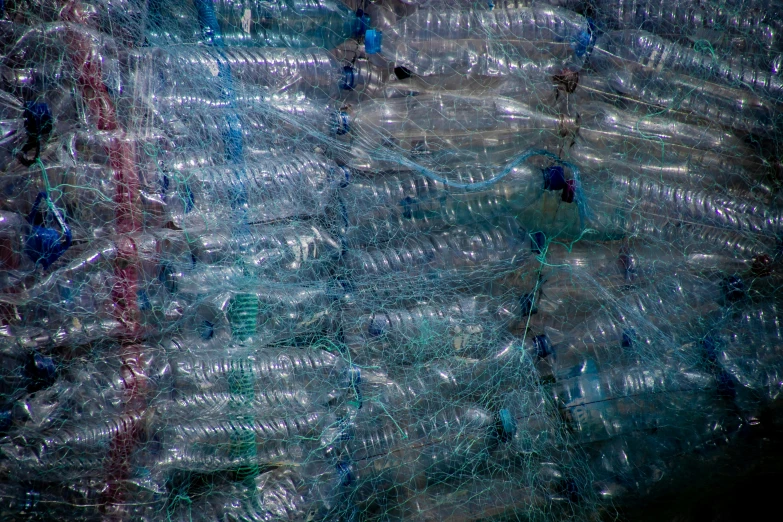 a bunch of plastic bottles stacked on top of each other, an album cover, pexels, plasticien, water texture, netting, egypt, thumbnail