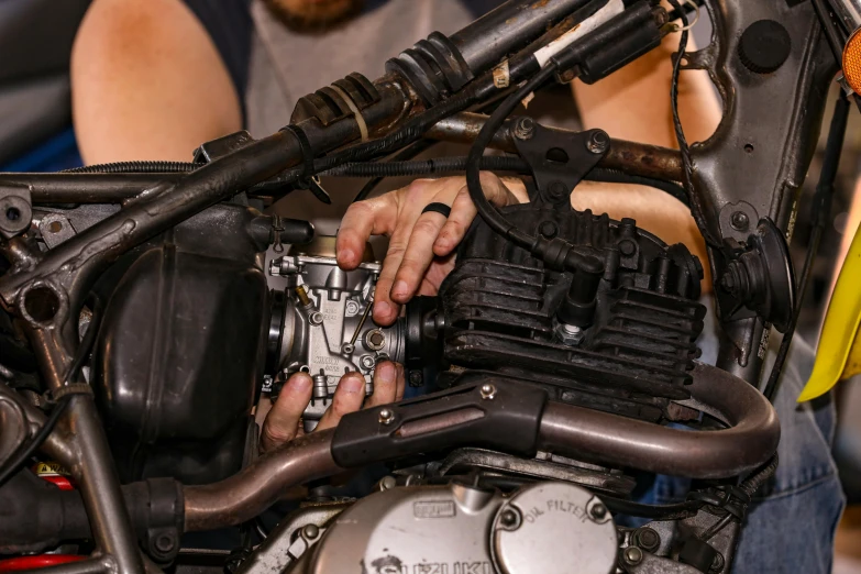 a close up of a person working on a motorcycle, unsplash, realistic engine, full frame image, rectangle, lachlan bailey