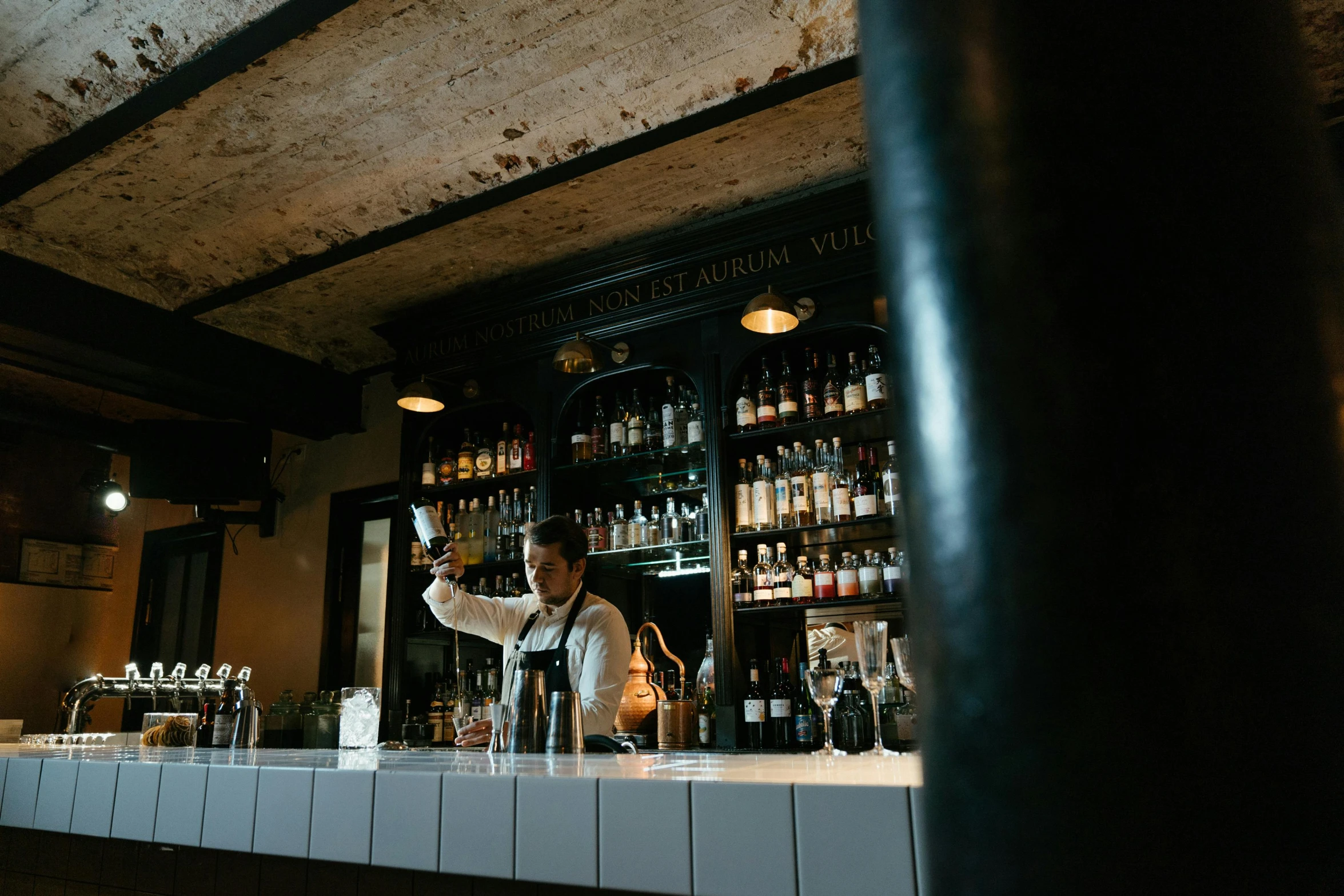 a man that is standing in front of a bar