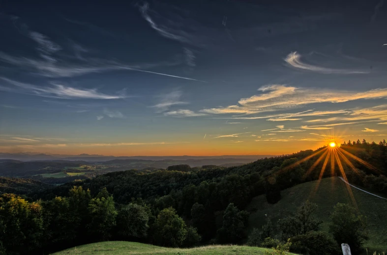 the sun is setting over a grassy hill, by Thomas Häfner, pexels contest winner, overlooking a valley with trees, panoramic, night setting, detmold