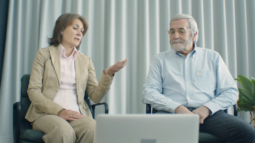 a man and a woman sitting in front of a laptop, jama jurabaev, arguing, dementia, worksafe. cinematic