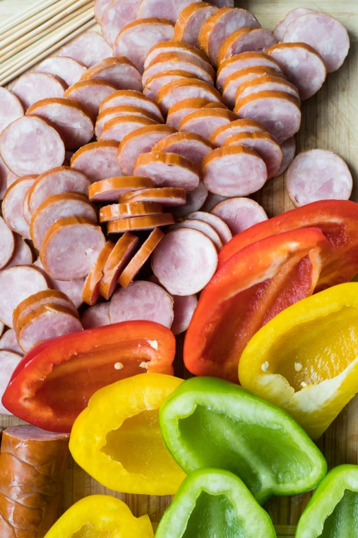 sausages, peppers, and peppers on a cutting board, dau-al-set, multiple colors, fan favorite, ham, snacks