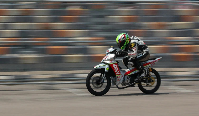 a person is riding a motorcycle on a track