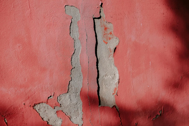 a red wall with a crack in it, pexels contest winner, concrete art, payne's grey and venetian red, background image, demolition, portrait image