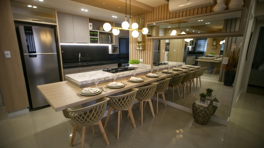 a kitchen with a table and chairs and plates on the counter