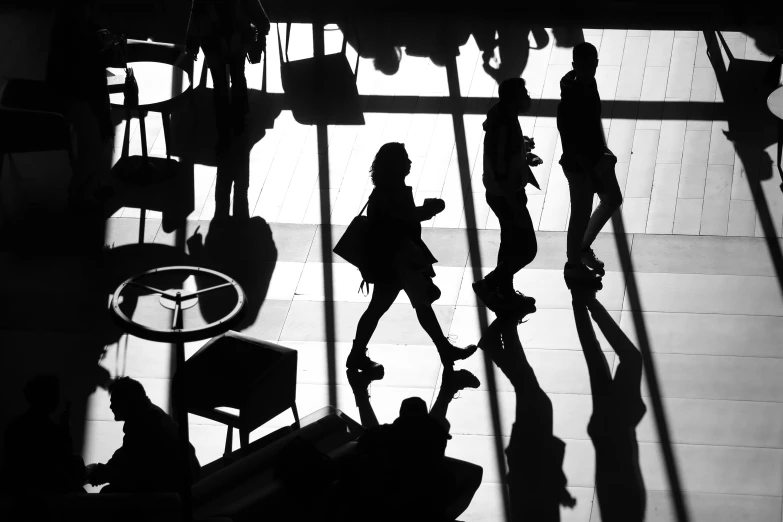 a black and white photo of people walking through a lobby, by Matthias Weischer, silhouette!!!, black. airports, getty images, sao paulo