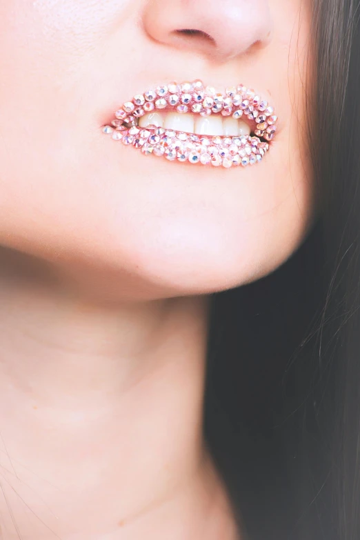 a close up of a woman with lipstick on her lips, an album cover, inspired by Hedi Xandt, trending on pexels, aestheticism, sparkling crystals, pink, full body extreme closeup, double chin