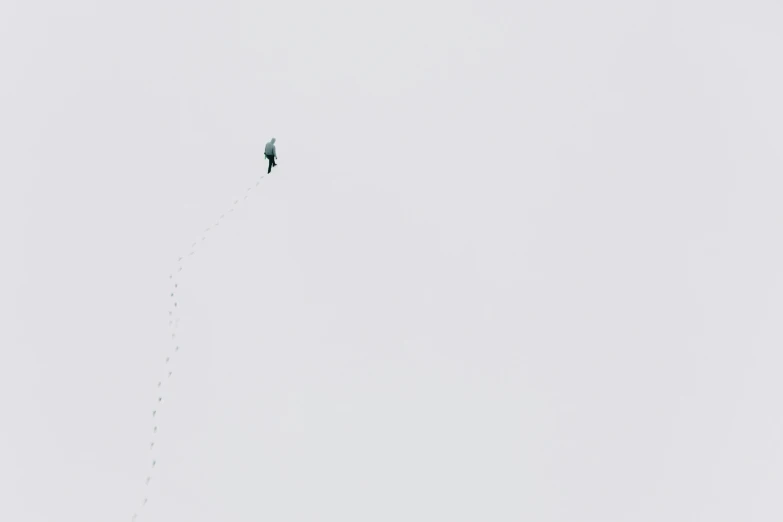 a person is flying a kite in the sky, a minimalist painting, by Matthias Weischer, pexels contest winner, postminimalism, footsteps in the snow, climber, very very small goat, fear of heights