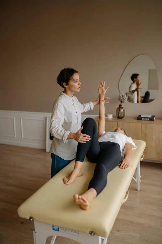 a woman getting a massage in a room, ouchh and and innate studio, thumbnail, stretch, jaime jasso