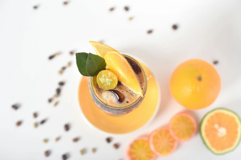 a glass filled with a drink sitting on top of a table, grey orange, flatlay, 🐿🍸🍋, profile image