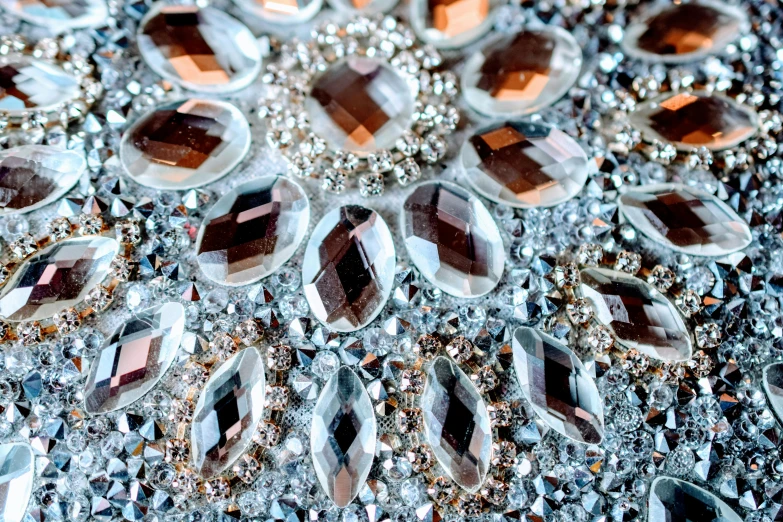 a close up of a piece of jewelry on a table, a mosaic, by Maksimilijan Vanka, featured on pixabay, crystal cubism, gradient brown to silver, crystal clusters, lots of glass details, ornate with white diamonds