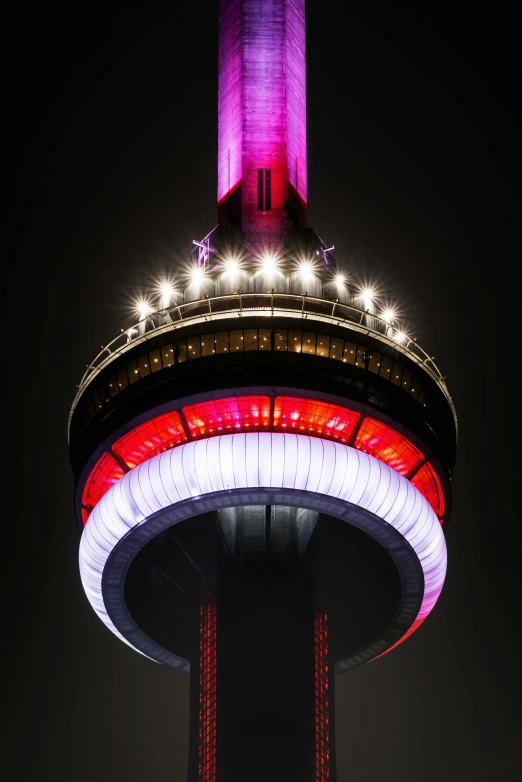 a tall tower lit up with red, white and blue lights, by Doug Ohlson, pexels contest winner, second colours - purple, dome, toronto, ring lit