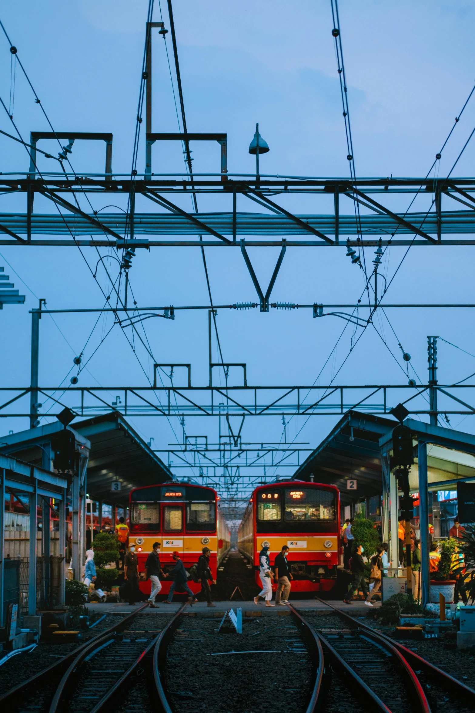 a couple of trains that are on some tracks, a picture, unsplash contest winner, art nouveau, jakarta, bus station, market in japan, 🚿🗝📝