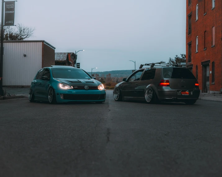 a couple of cars are stopped in the street