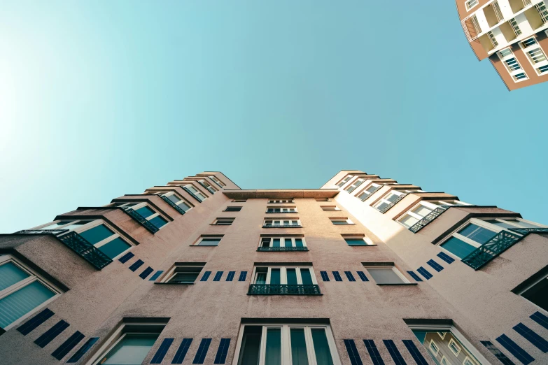 looking up at a tall building from the ground