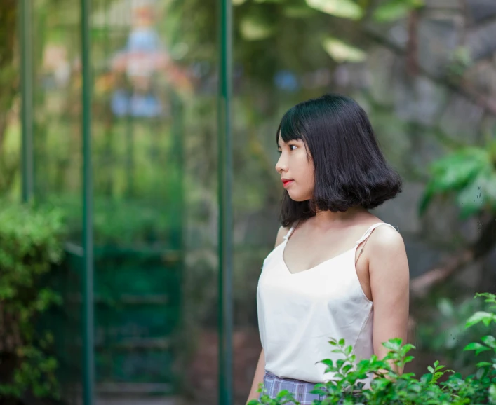 a woman standing in the middle of a garden, by Tan Ting-pho, visual art, white french bob hairstyle, half asian, medium format, profile pic