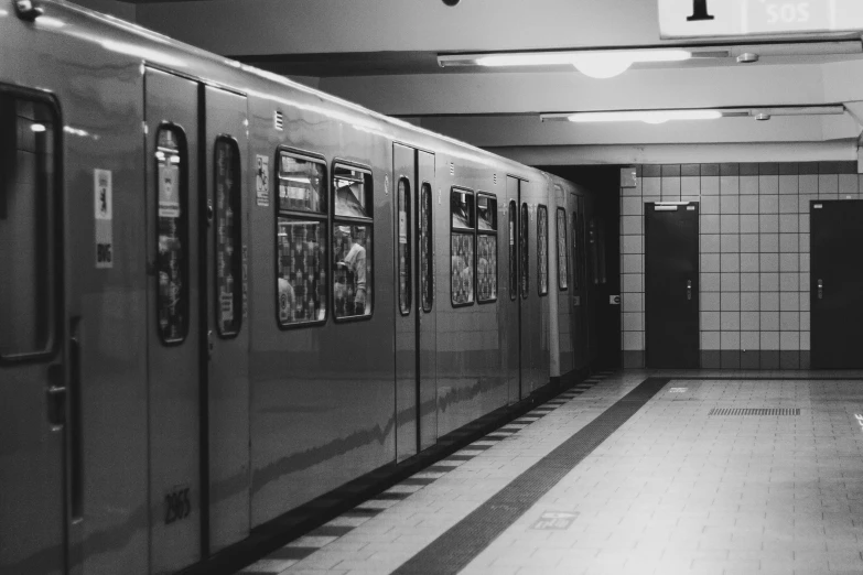 a black and white photo of a subway train, a black and white photo, unsplash, rows of doors, berlin 1 9 8 2, square, uploaded