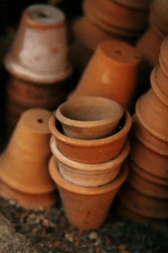 a pile of clay pots sitting next to each other, photograph credit: ap, small plants, brown:-2, fan favorite