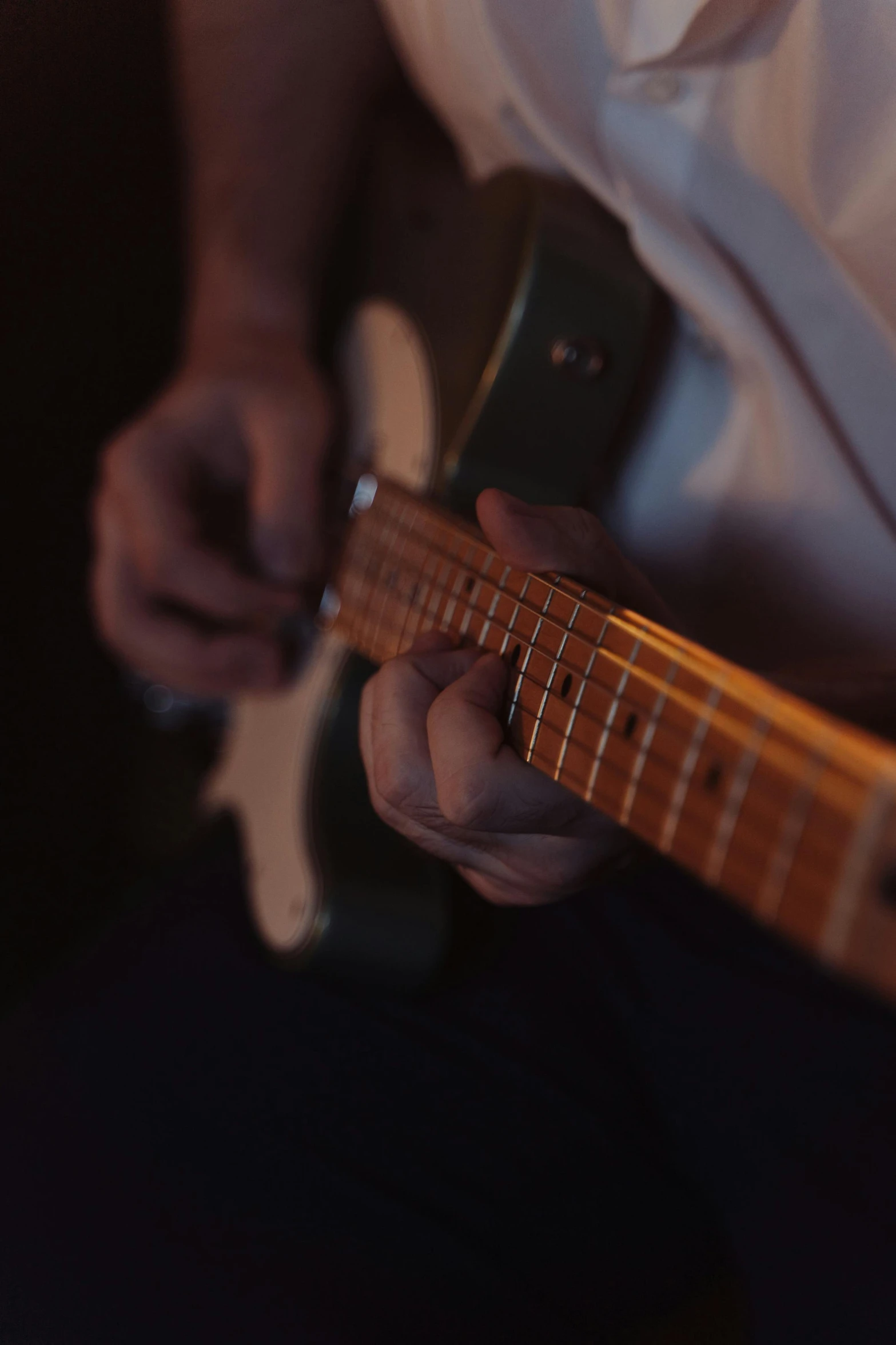 a close up of a person playing a guitar, quiet intensity, lachlan bailey, no cropping, rectangle