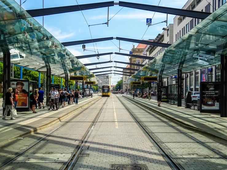 a city trolley rides along a narrow train track
