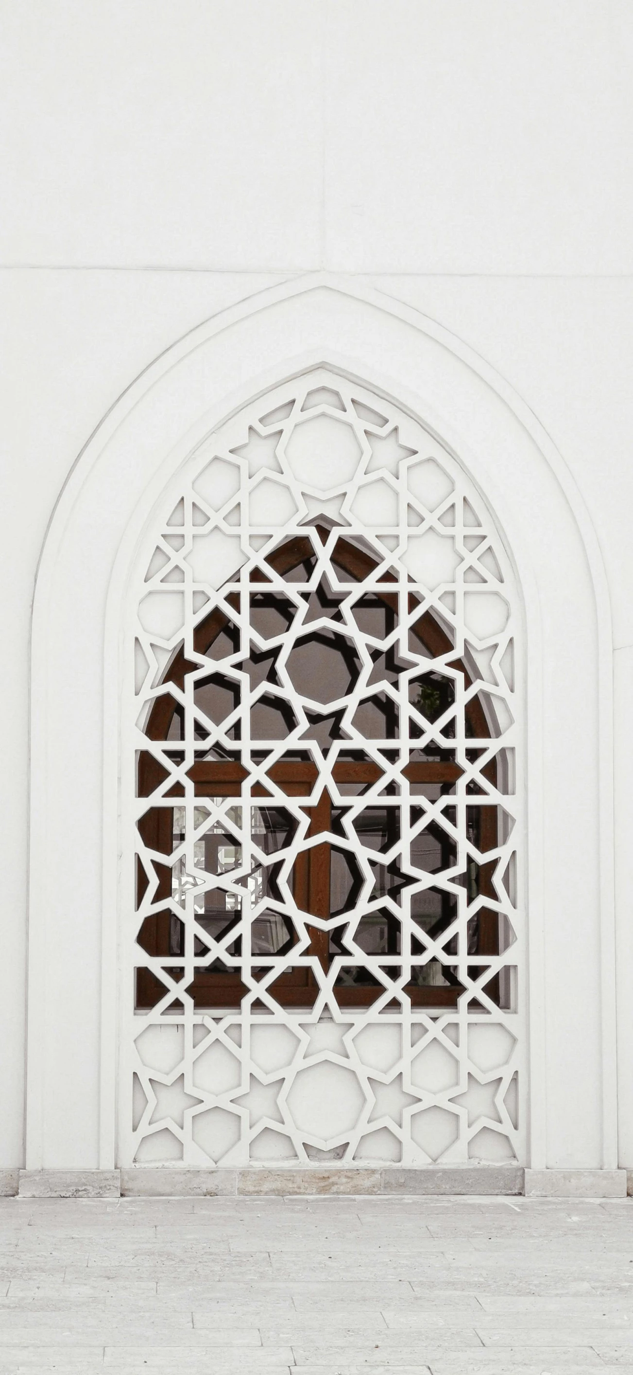 a red fire hydrant sitting in front of a white building, inspired by Riad Beyrouti, arabesque, church window, laser cut, alessio albi, detailed white