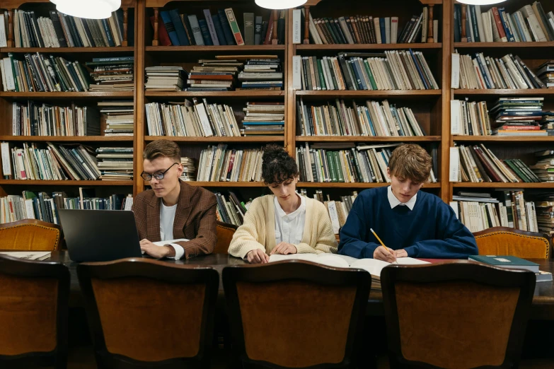 a group of people sitting at a table with laptops, by Emma Andijewska, pexels contest winner, academic art, book library studying, still from a movie, academic clothing, thumbnail