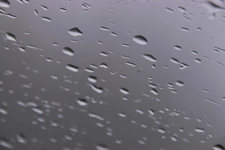 a close up of water droplets on a window, inspired by Vija Celmins, pexels, photorealism, 3 d octane render 8 k, gray sky, pbr material, low-angle