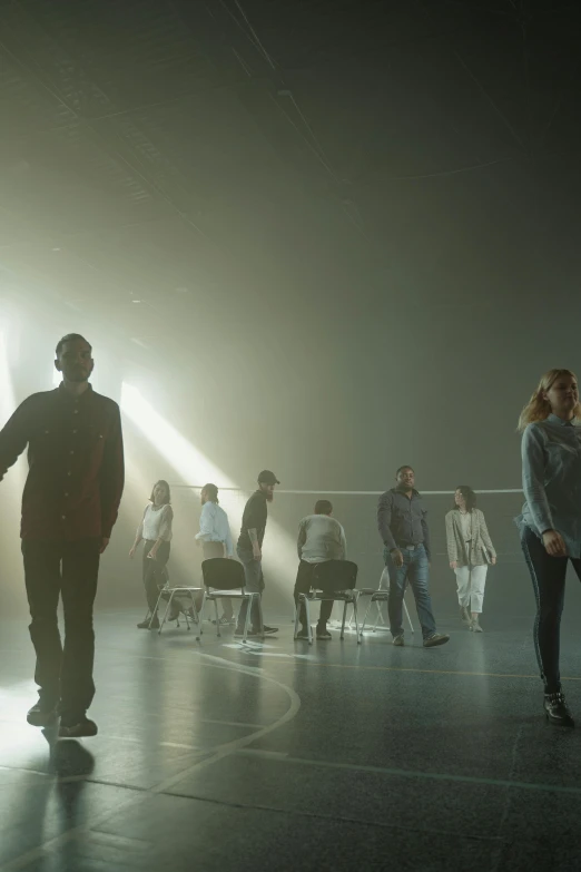 a group of people standing on top of a stage, a hologram, by Jonas De Ro, conceptual art, movie still of emma watson, volumetric lighting and fog, passengers, standoff