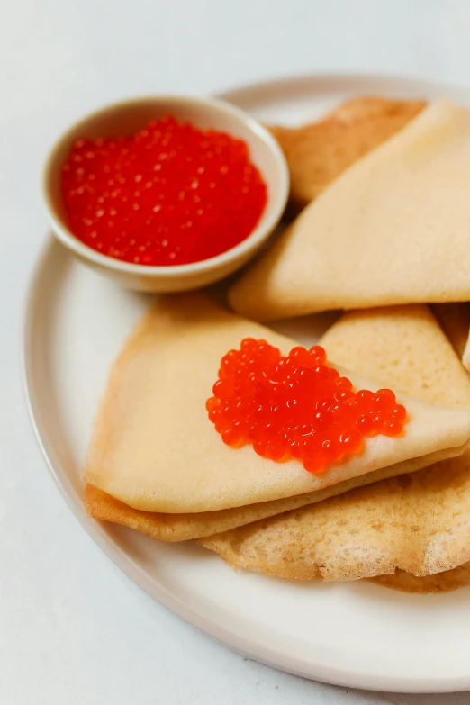 a plate with ers with sauce on top