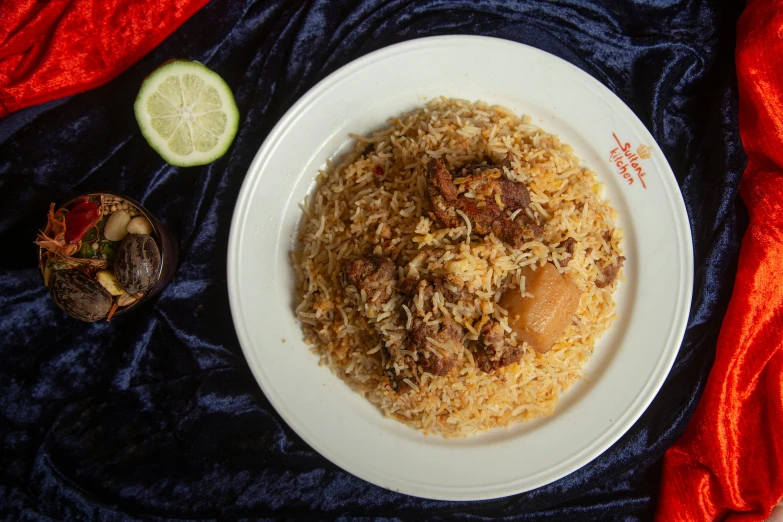 a white plate topped with rice and meat next to a cucumber, hurufiyya, thumbnail, ornately dressed, dubai, fully body photo