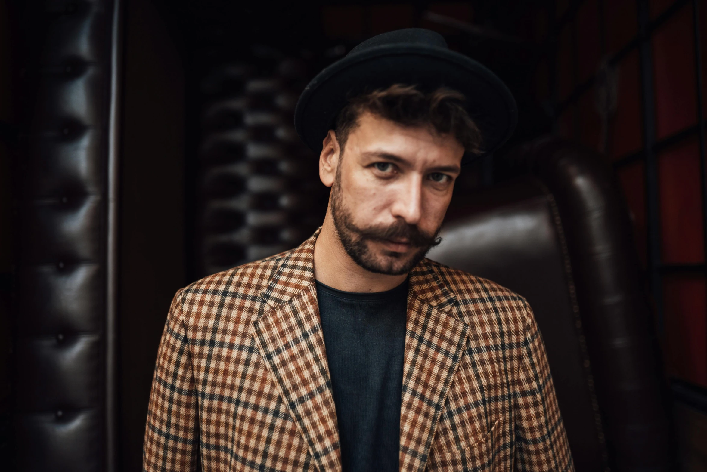 a man with a beard wearing a jacket and hat, an album cover, inspired by Germán Londoño, pexels contest winner, portrait pose, brown, diego fernandez, aiden gillen