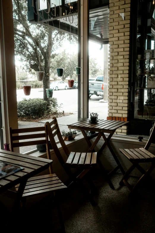 an outside area with benches and tables on the ground