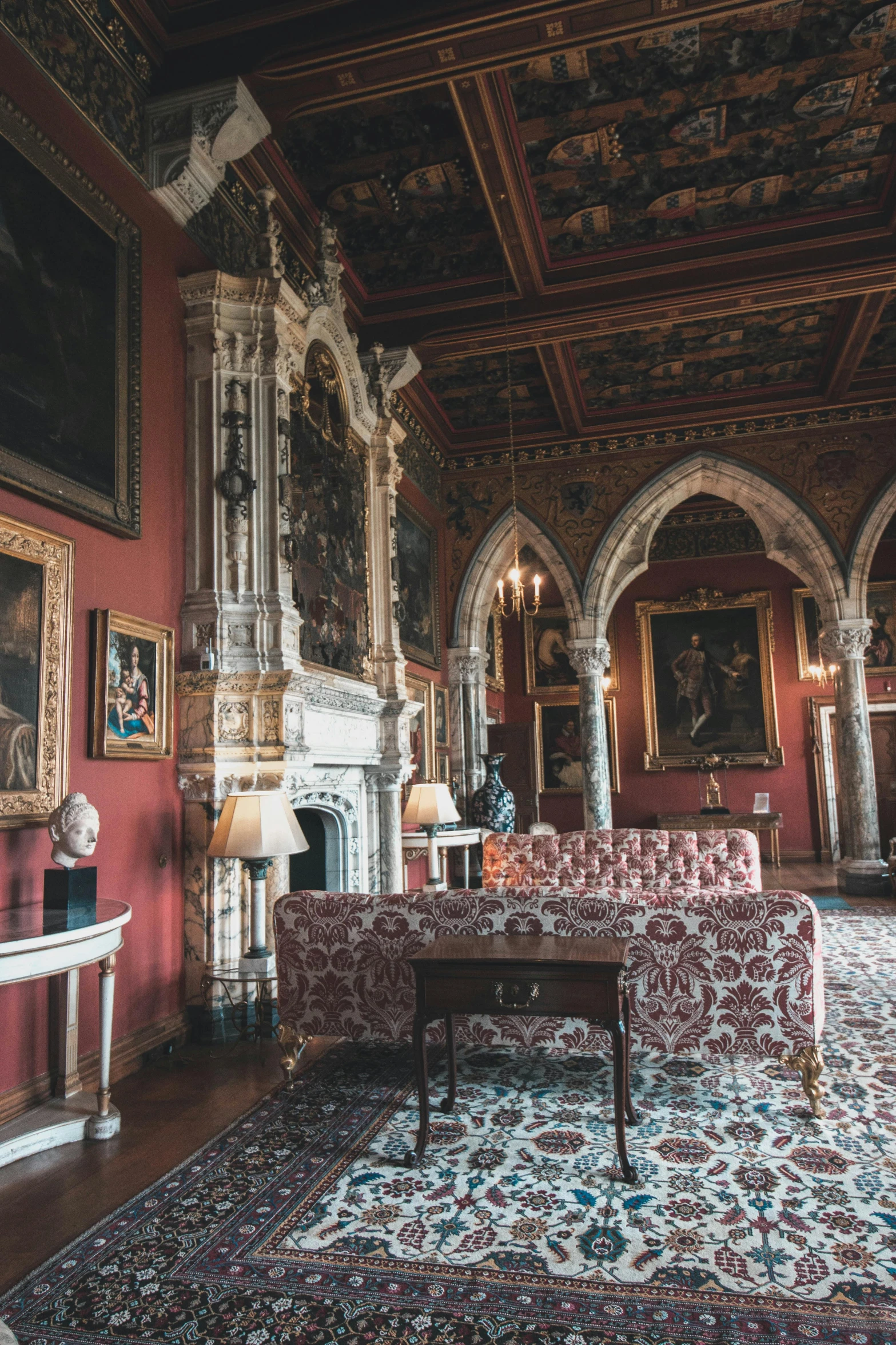 a living room filled with furniture and a fire place, by Daniel Seghers, gothic castle, red and white marble panels, tourist photo, thumbnail