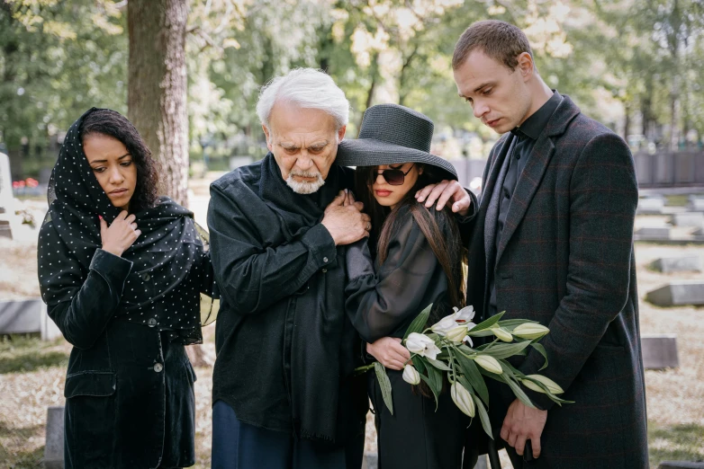 a group of people standing next to each other, funeral, profile image, adult, upset