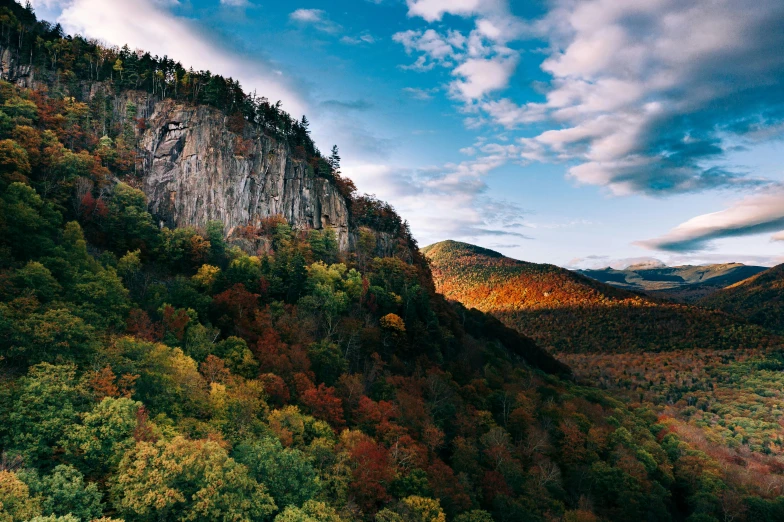 the view is looking down at a mountain top