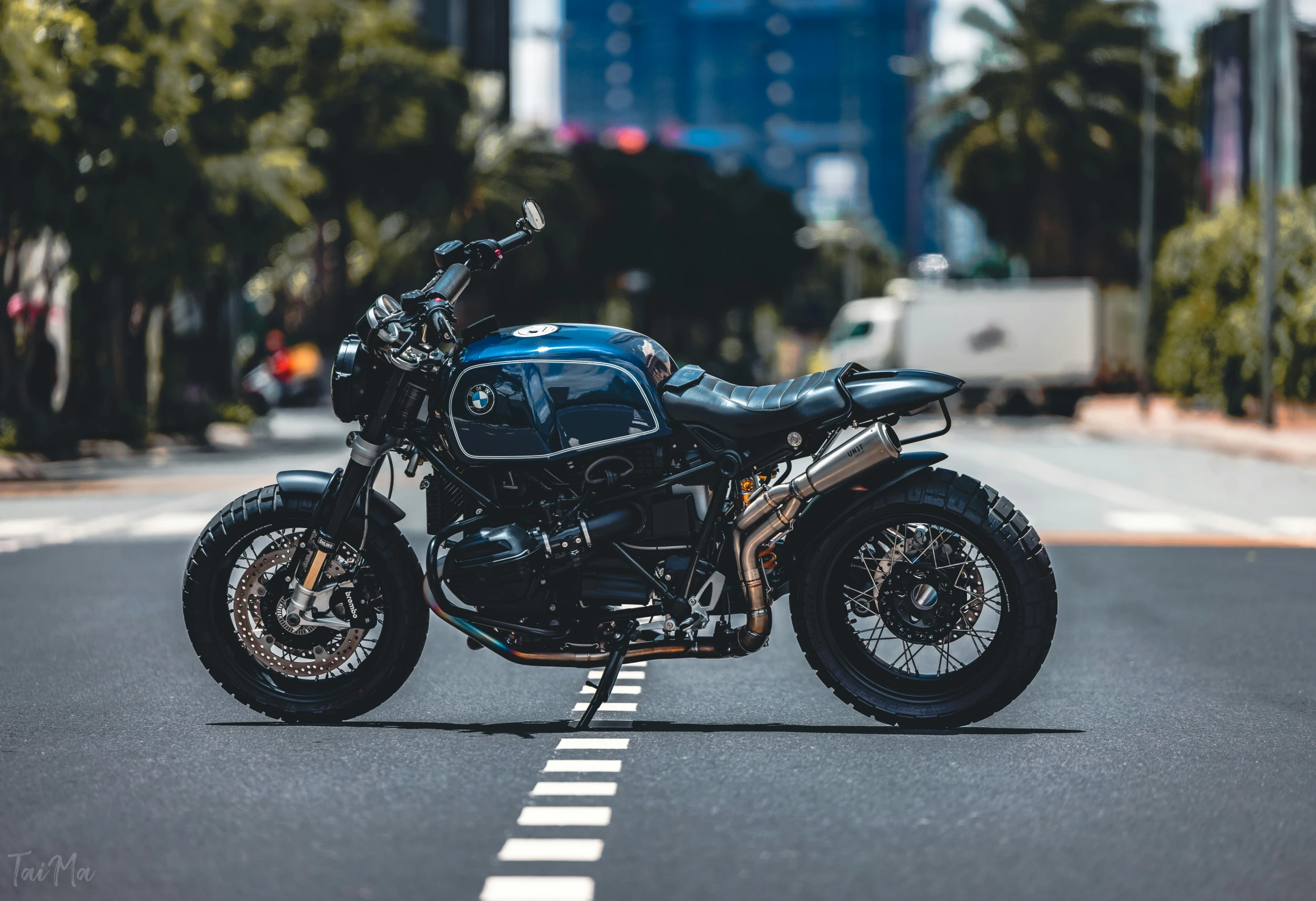 a black motorcycle is parked on the street