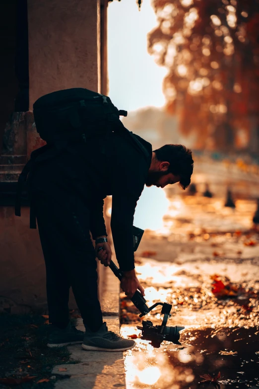 a man is using a wheel brush on a city street